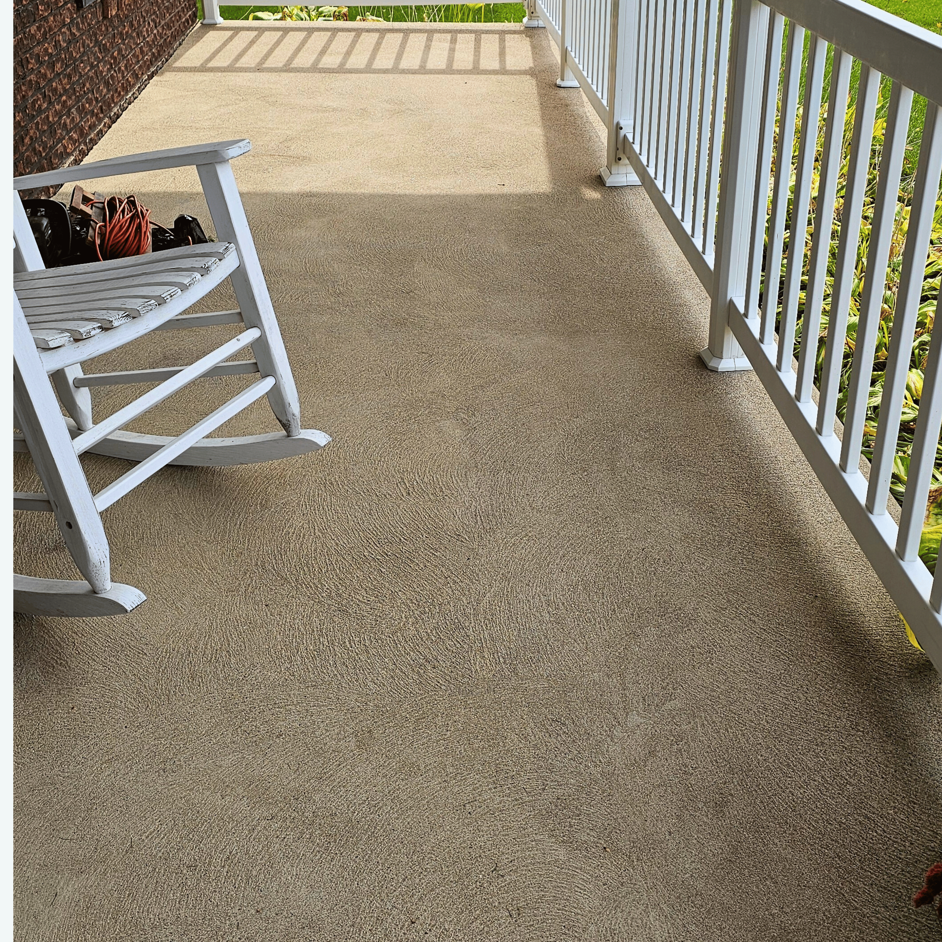 Front porch concrete stained and algae covered before washing